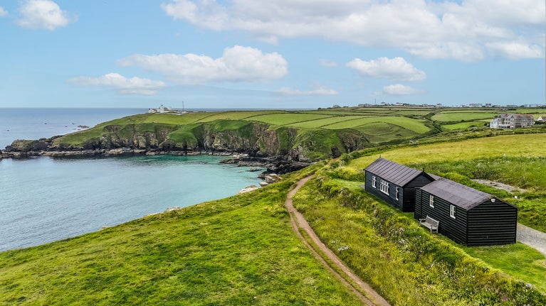 An aerial view of Wireless Cottage and the surrounding coast, Cornwall